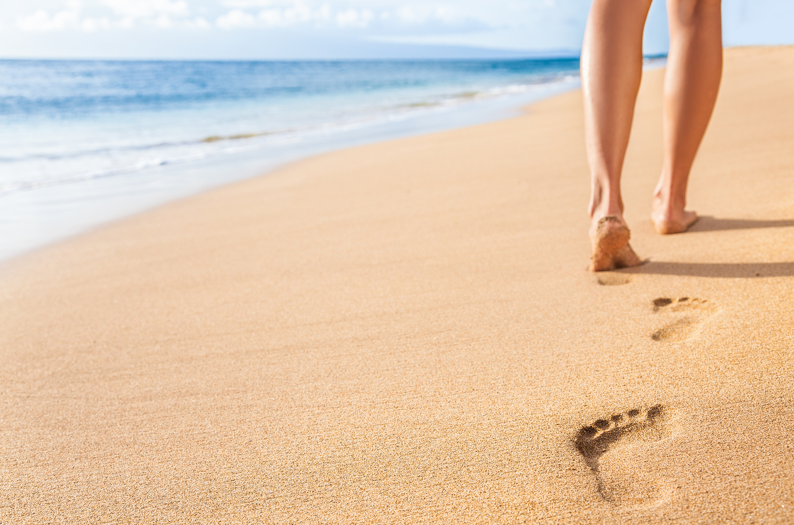 woman relaxing walking on sand beach